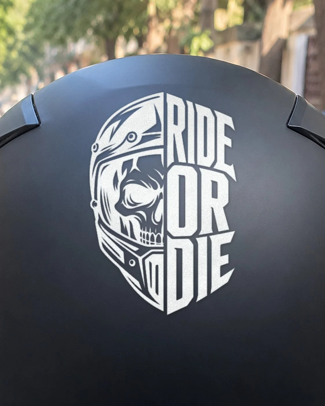 Ride or Die bike patch in white ink on a helmet
