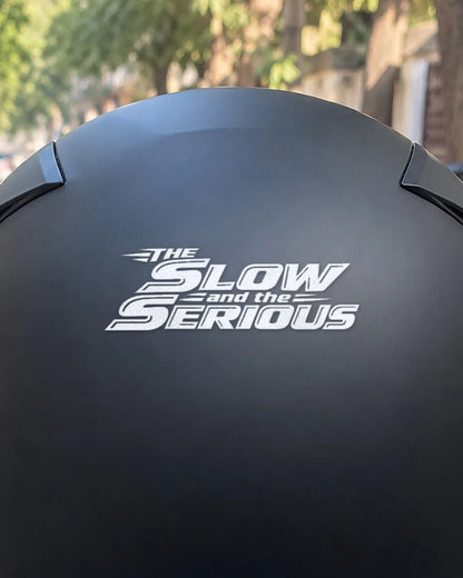The Slow and the Serious bike patch in white ink on a helmet