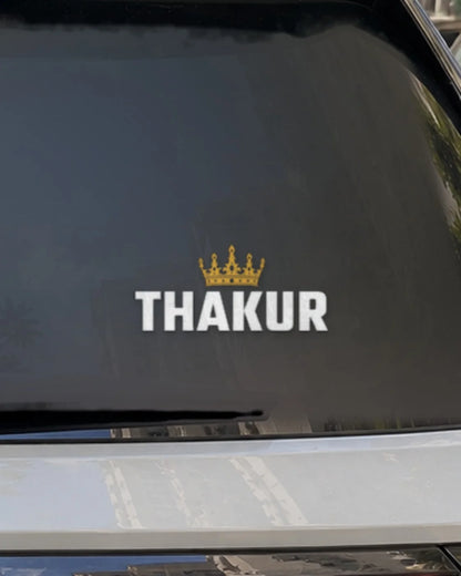 Thakur car patch on a car rear glass