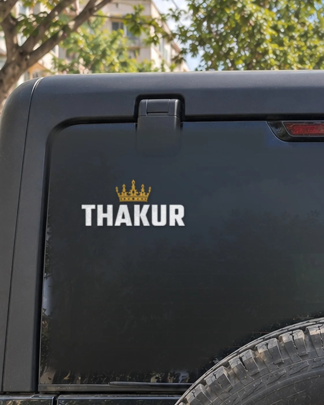 Thakur car patch on a car rear glass