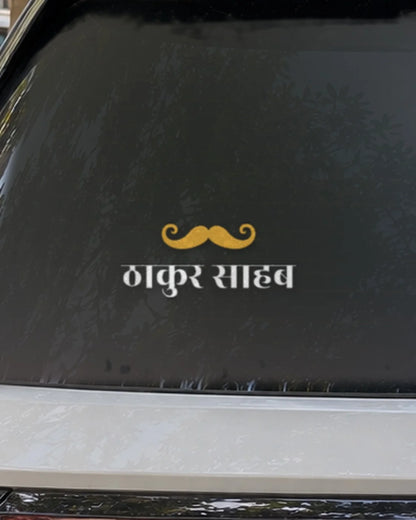Thakur car patch on a car rear glass