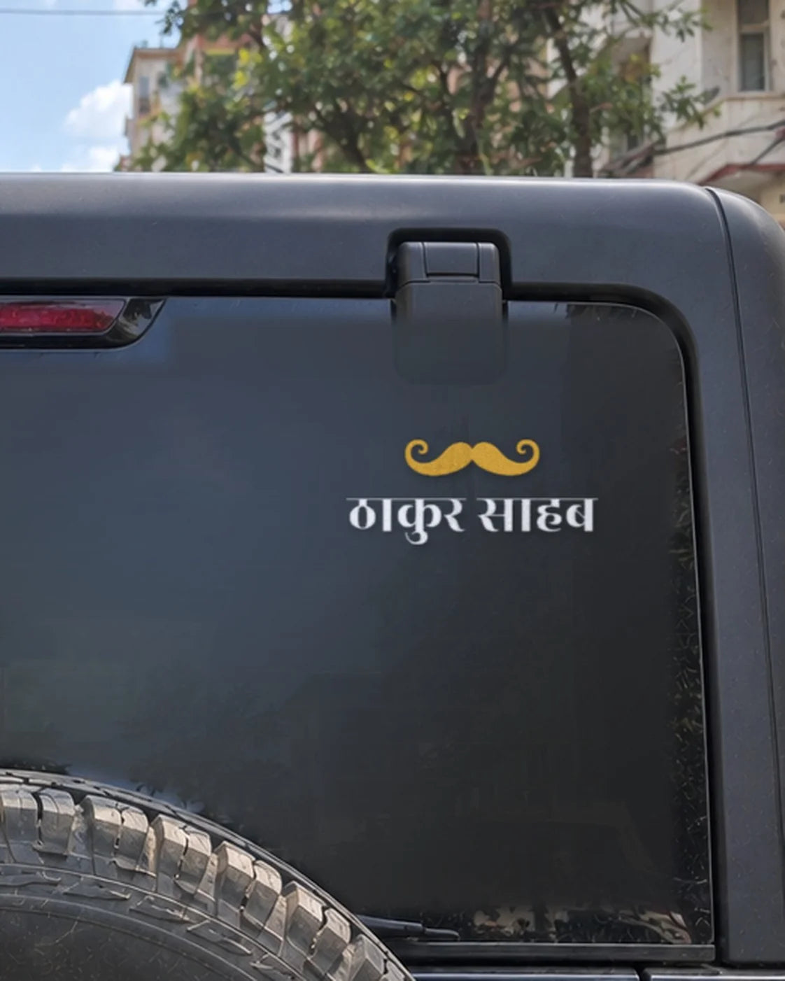 Thakur car patch on a car rear glass