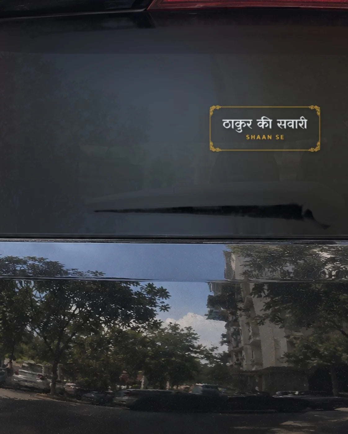 Thakur car patch on a car rear glass