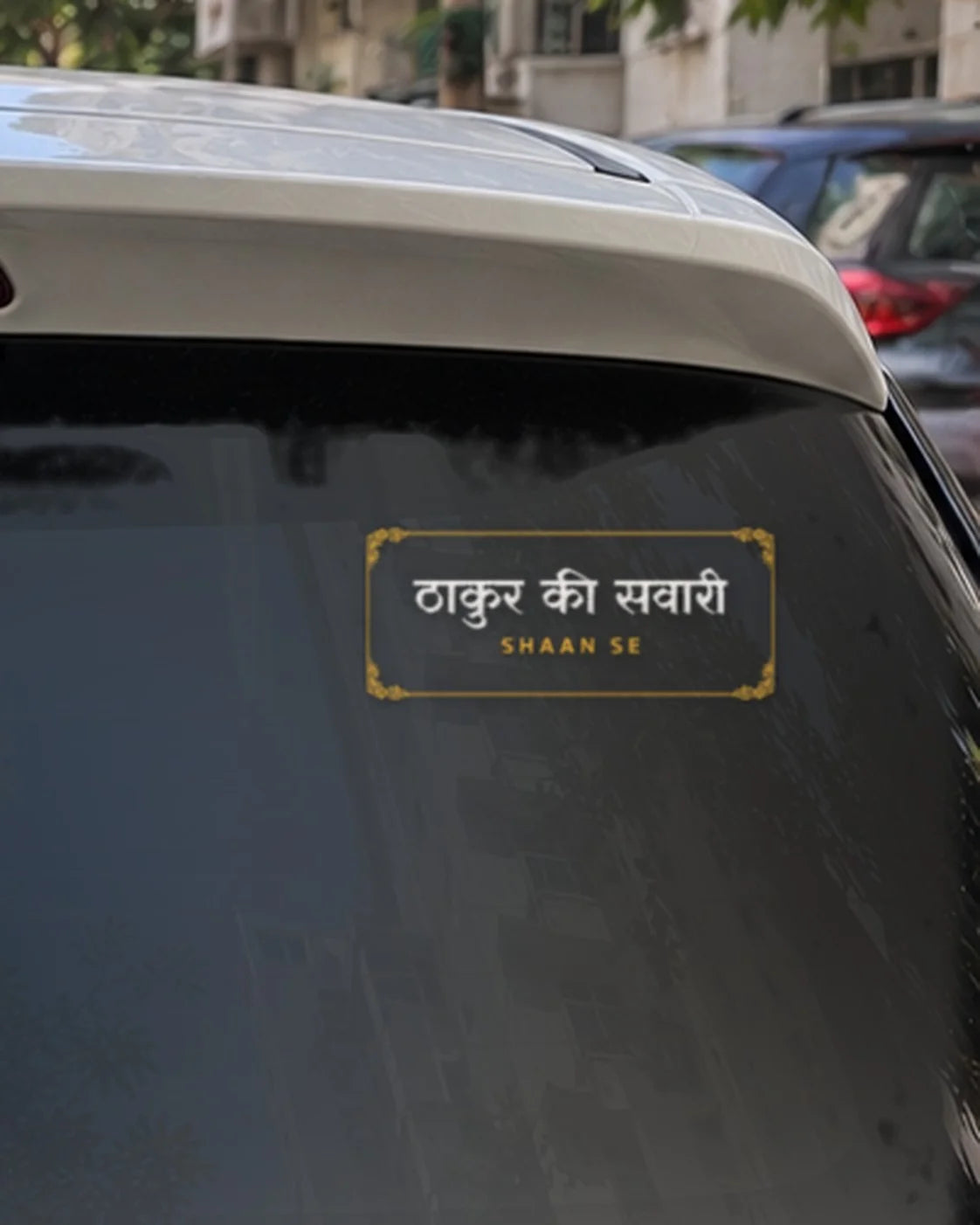 Thakur car patch on a car rear glass