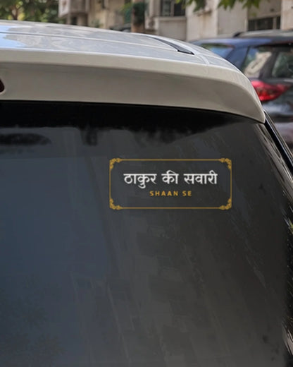 Thakur car patch on a car rear glass