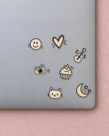 Tiny Doodles mini patches on a laptop