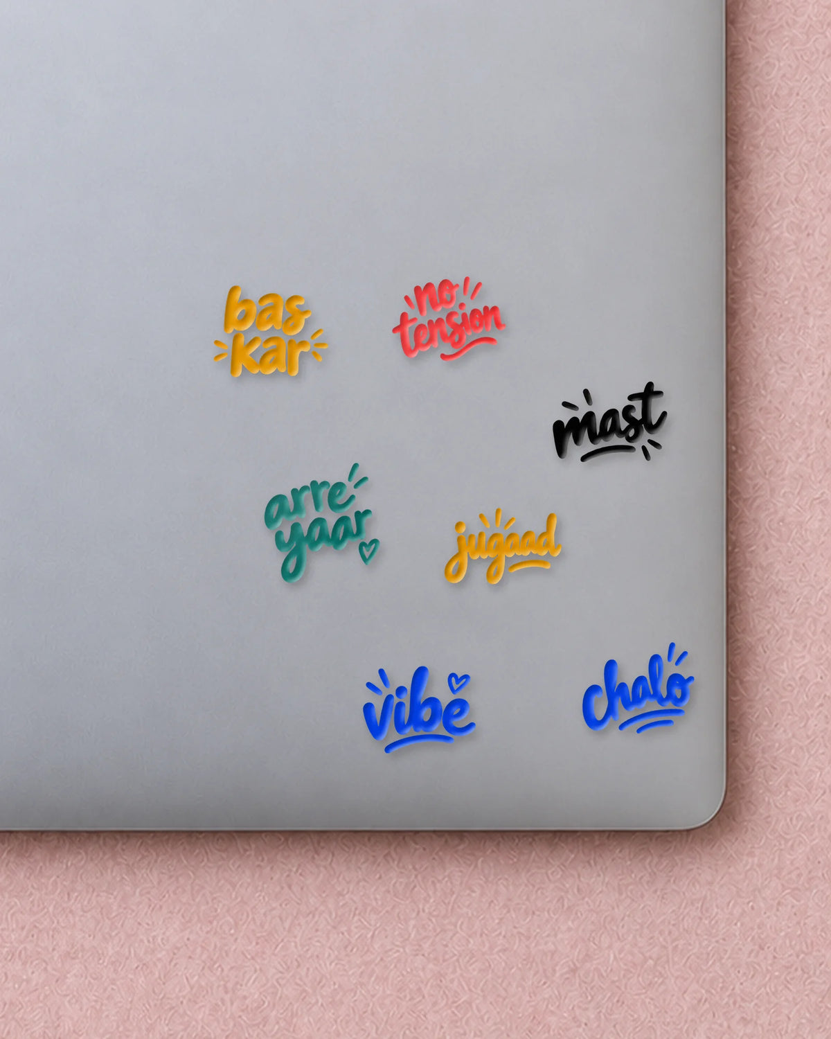 Tiny Words mini patches on a laptop