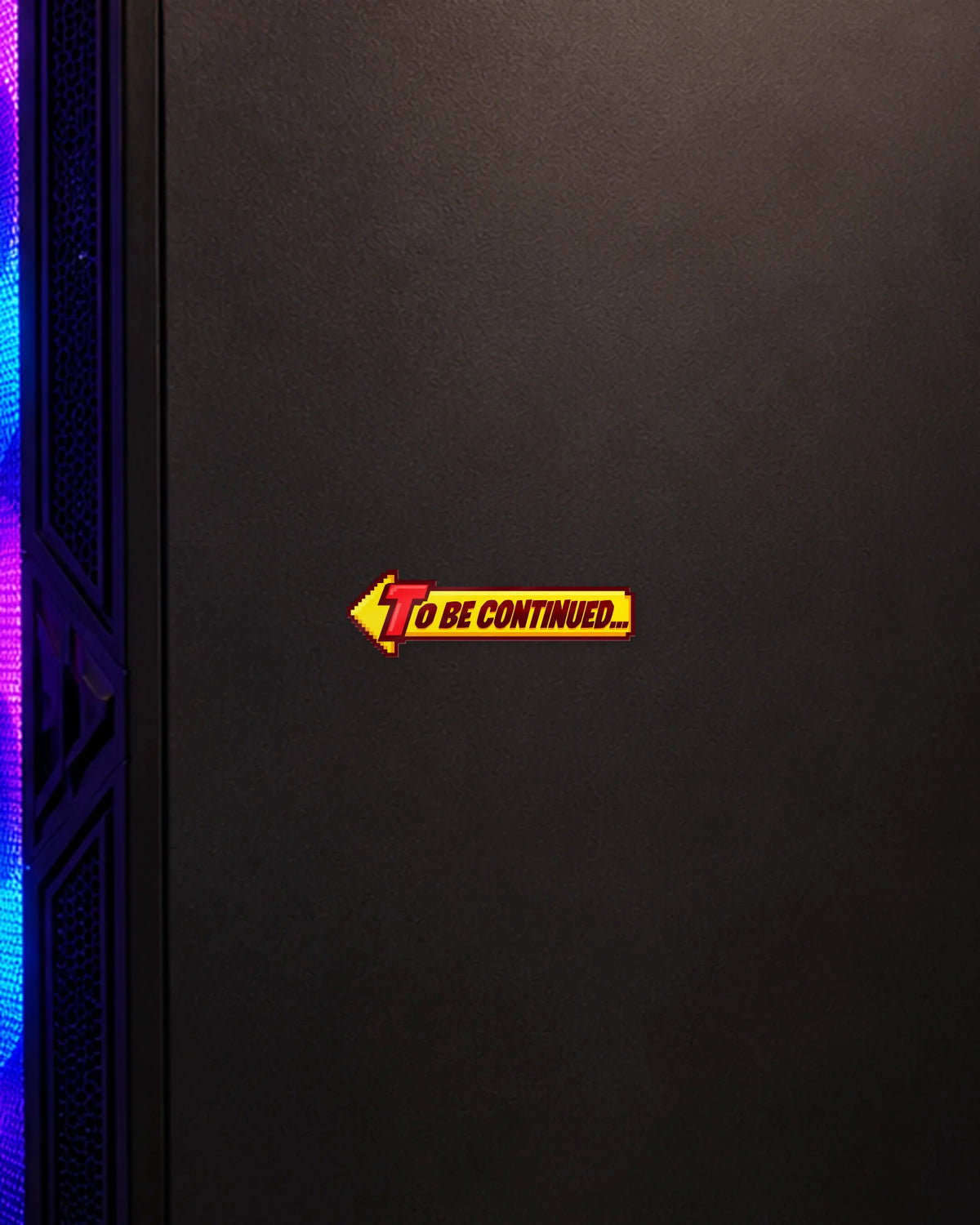 To Be Continued gamer patch on a gaming PC cabinet