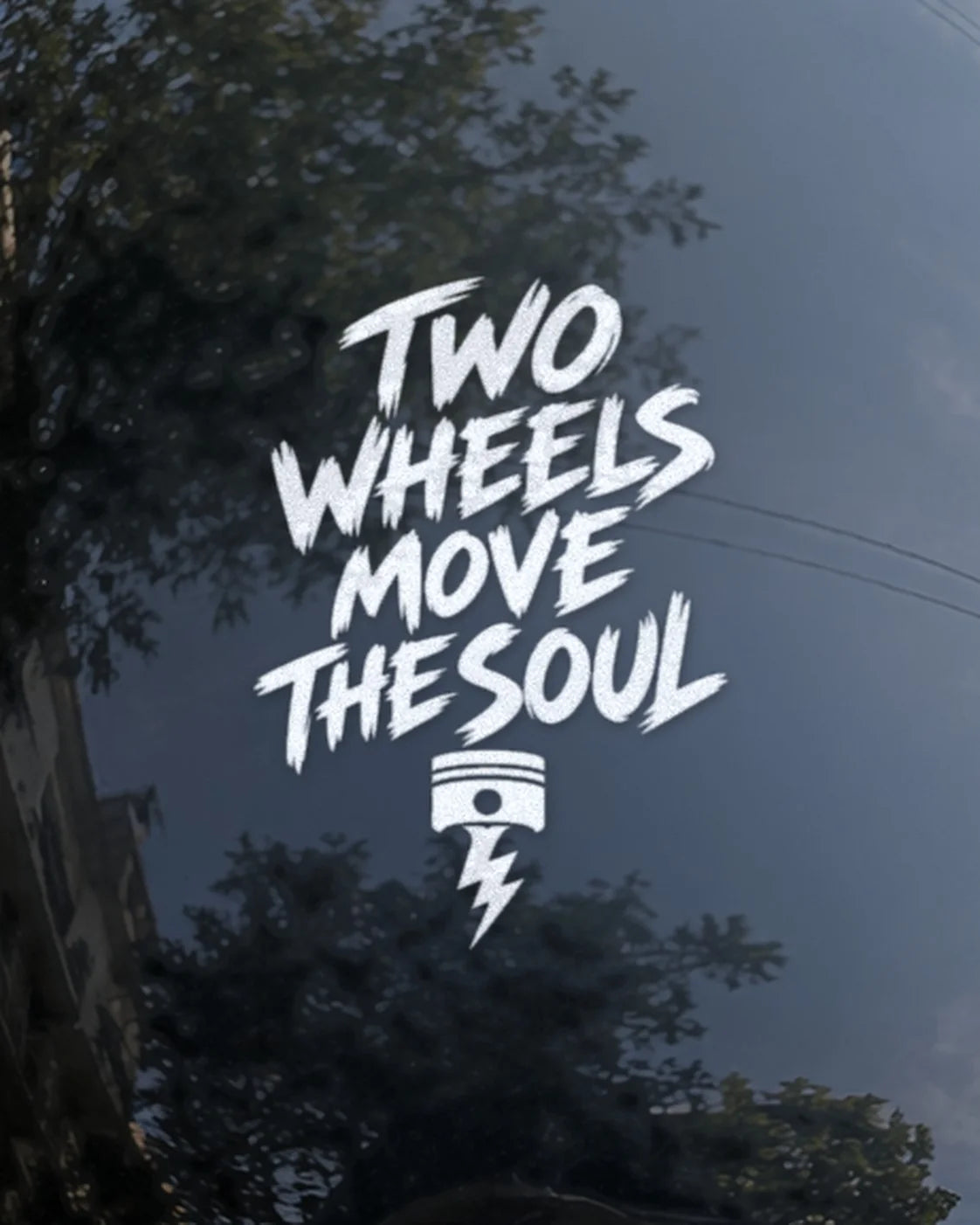 Two Wheels Move the Soul bike patch in white ink on a bike