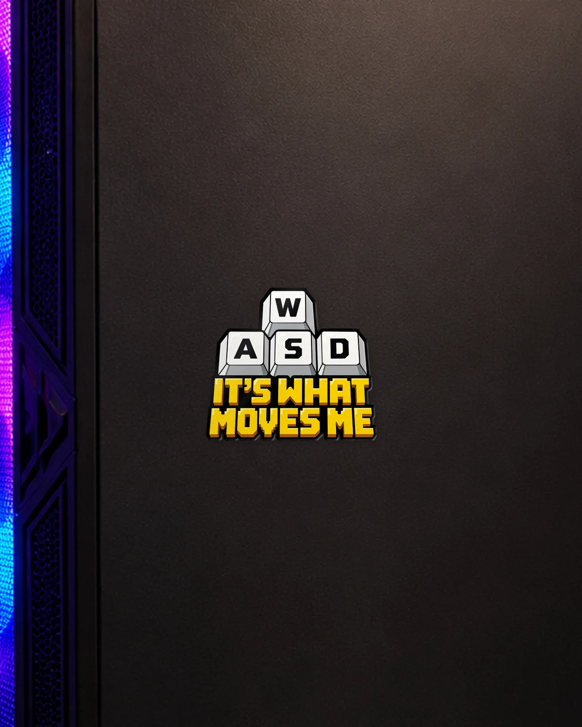 WASD It's What Moves Me gamer patch on a gaming PC cabinet
