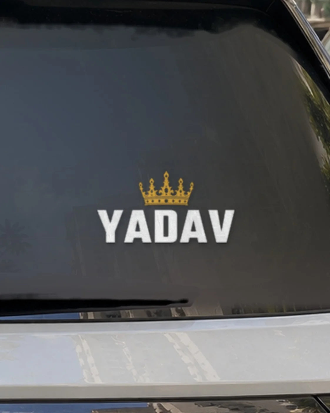 Yadav car patch on a car rear glass