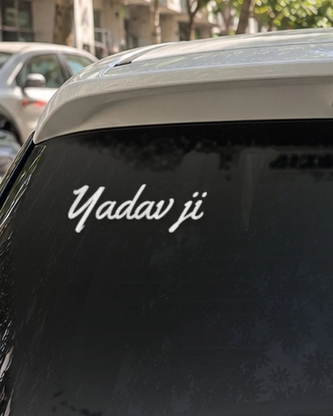 Yadav car patch on a car rear glass
